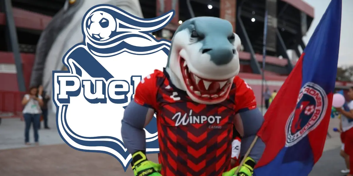Mascota del Veracruz junto al escudo del Club Puebla / FOTO PUBLIMETRO